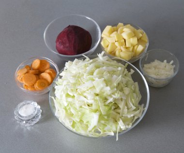Cuted potato, onion, beet, carrot and ca clipart