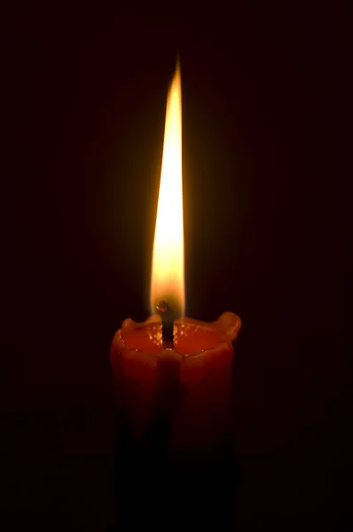 Καίγοντας κερί που απομονώνονται σε μαύρο — Φωτογραφία Αρχείου