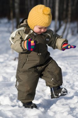 Winter baby stap against snow forest clipart