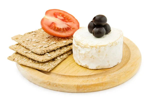 Brie cheese and organic crackers. Royalty Free Stock Images