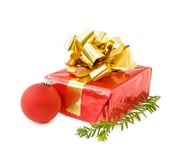 Christmas festive gifts and red bauble — Stock Photo, Image