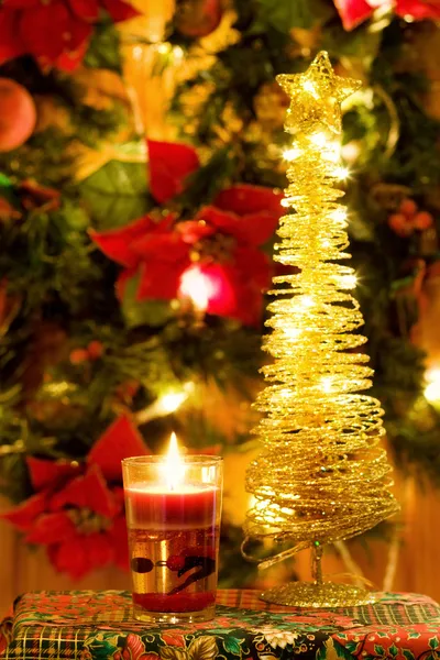 Magic Christmas candle and golden tree — Stock Photo, Image