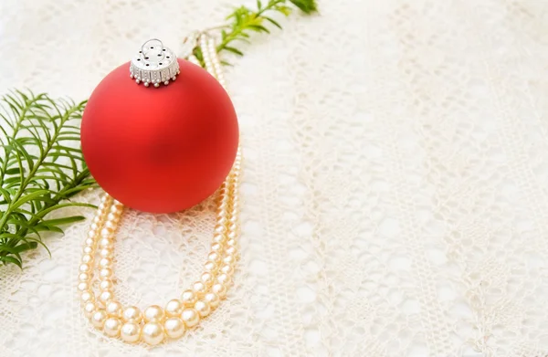 Christmas red bauble with vintage pearls — Stock Photo, Image
