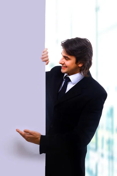 Business man handing a blank — Stock fotografie