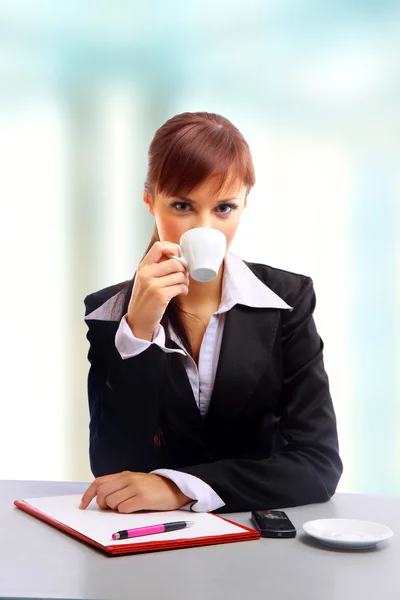 Businesswoman working at desk Royalty Free Stock Images