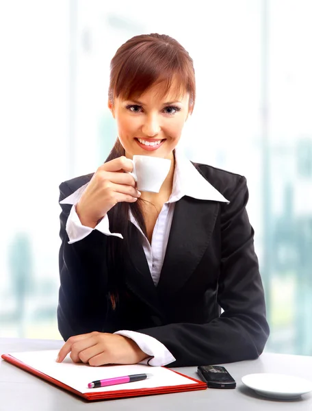Businesswoman working at desk, isolated Royalty Free Stock Photos