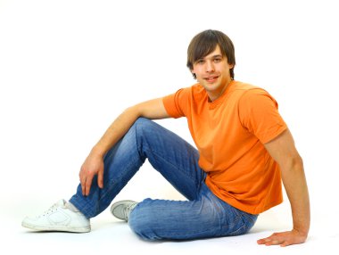 Casual young satisfied man sitting relax clipart