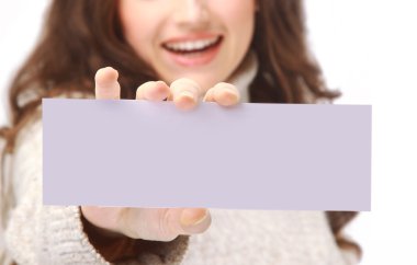 Young woman holding an empty billboard over white background clipart