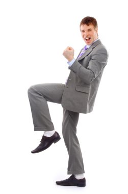 One very happy energetic businessman with his arms raised clipart