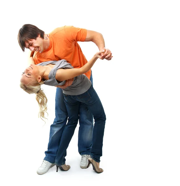 Young couple in black attire dancing happily — Stock Photo, Image