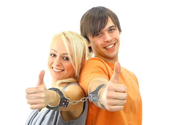 Portrait of a young teenage couple smiling against white background — Stock Photo, Image