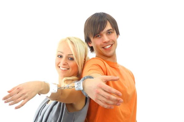 Retrato de um jovem casal adolescente sorrindo contra fundo branco — Fotografia de Stock