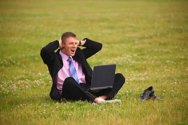 Young guy is working outdoors — Stock Photo, Image