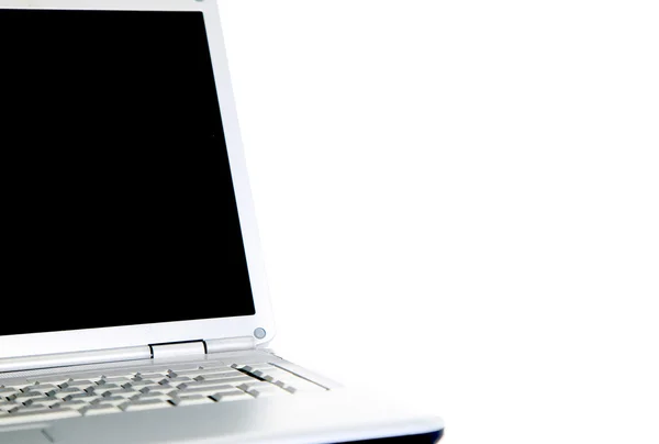 Moderne laptop geïsoleerd op wit met reflecties op glazen tafel. — Stockfoto