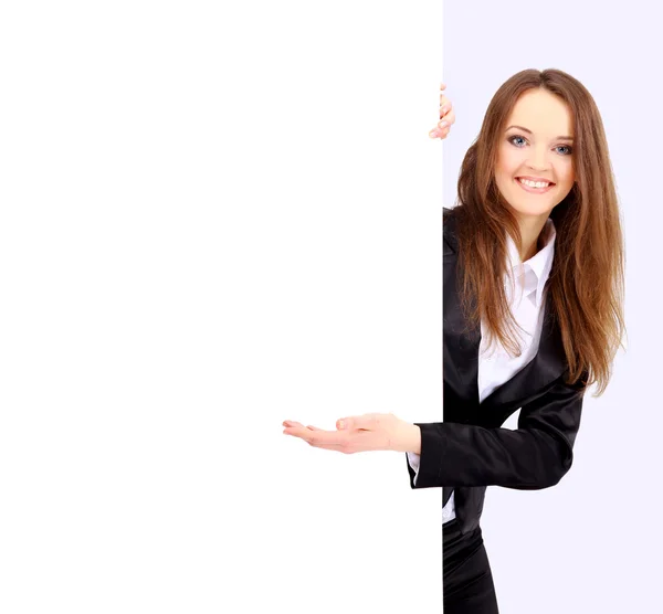 空白のボードの横に立っている女性実業家の分離します。 — ストック写真