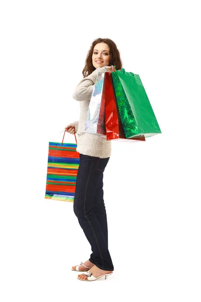 Mujer sosteniendo bolsas de compras contra fondo blanco aislado — Foto de Stock