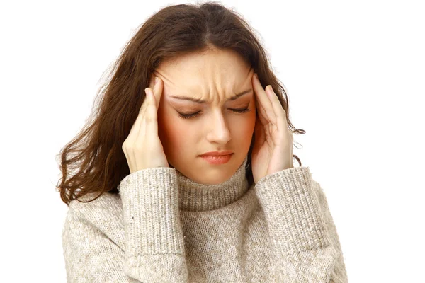 Yuong woman holding head in pain over white background — Stock Photo, Image