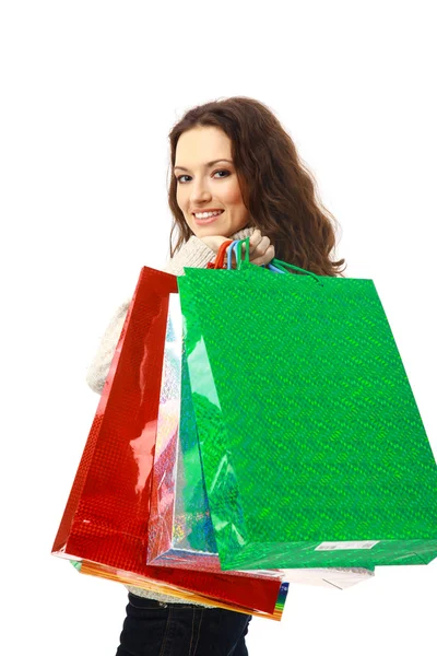 Retrato de una mujer joven sosteniendo varias bolsas de compras —  Fotos de Stock