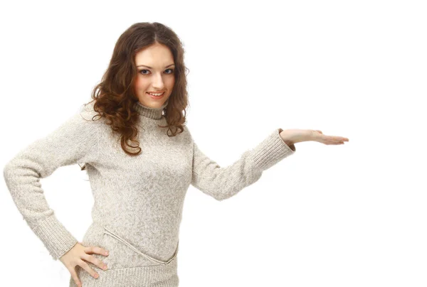 Happy young woman pointing upwards — Stock Photo, Image