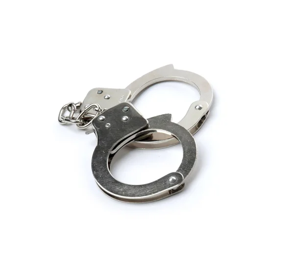 Пара наручників ізольована на сірому фоні — стокове фото