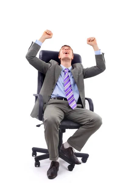 Uomo d'affari di successo di mezza età con pugno serrato seduto isolato su — Foto Stock
