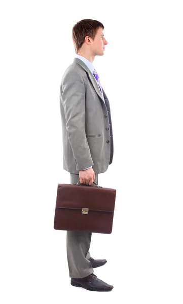 Ολόσωμο προφίλ μιας ηλικίας άνθρωπος των επιχειρήσεων με παλτό πάνω από τον ώμο ένα — Φωτογραφία Αρχείου