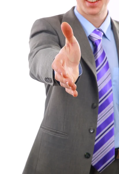 Jovem empresário cumprimentando com aperto de mão isolado em branco — Fotografia de Stock