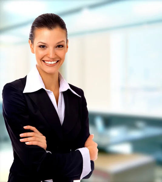 Mujer de negocios positiva sonriendo sobre fondo blanco Fotos de stock