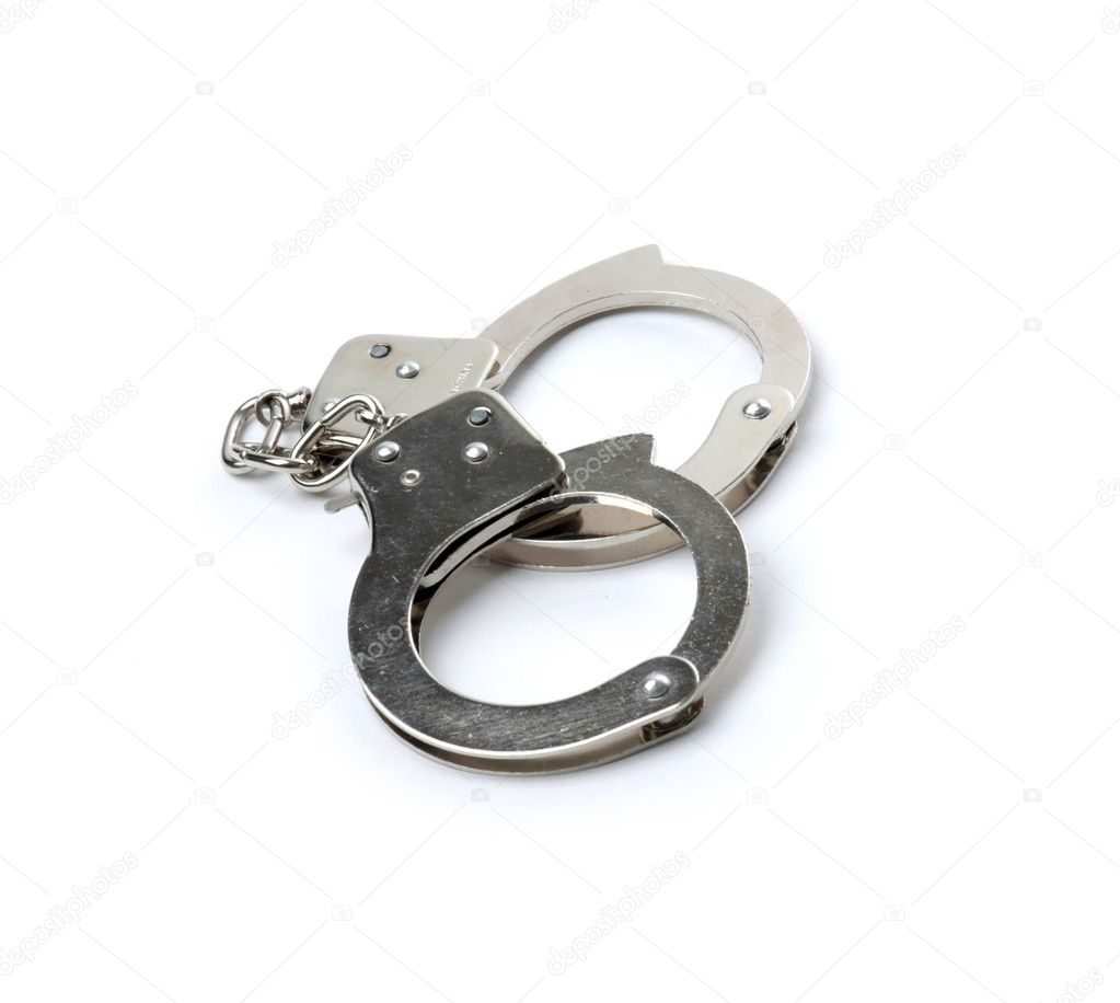 Pair of handcuffs isolated on a gray background