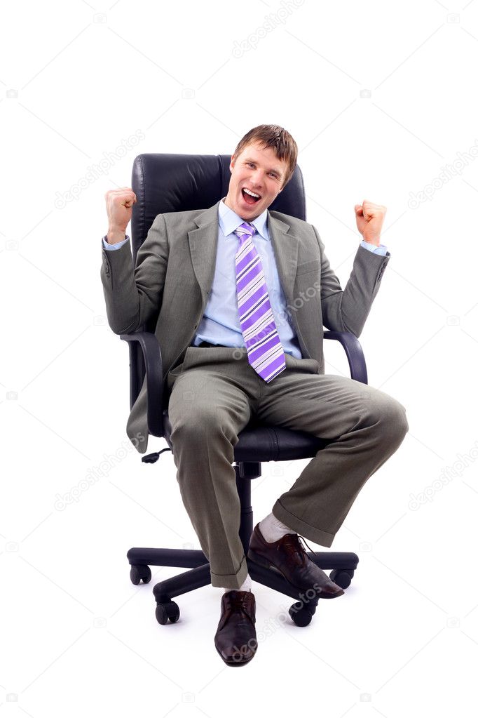 Happy business man sitting on a chair