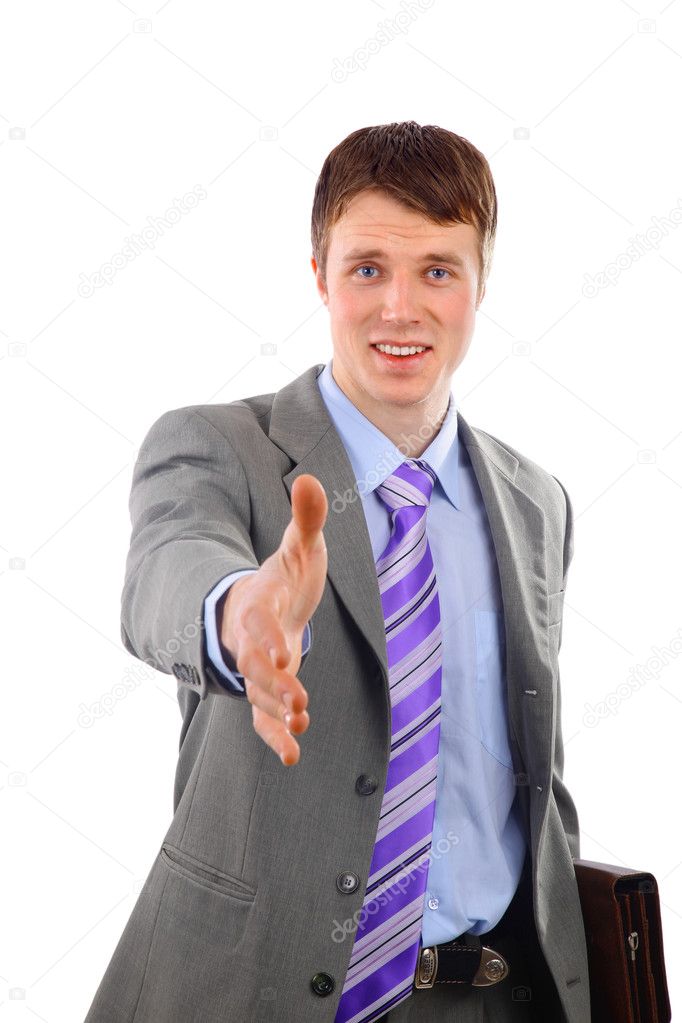 Young businessman greeting with handshake isolated on white