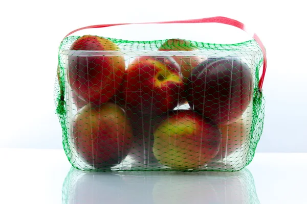 Peaches packed in a plastic container — Stock Photo, Image