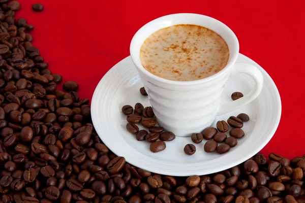 Cup with coffee and grain expressed on r — Stock Photo, Image