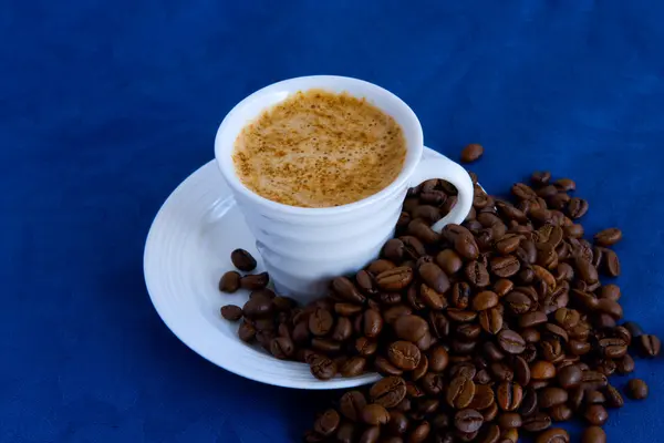 Cup with coffee and grain expressed on b — Stock Photo, Image