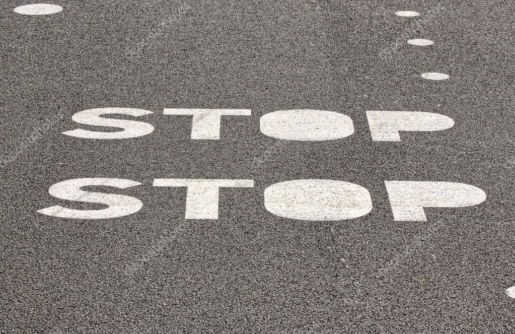 Stop sign on paved road — Stock Photo © kalnenko #1150144