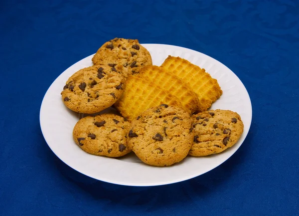 Cookies on a Plate on a blue background — Stock Photo, Image