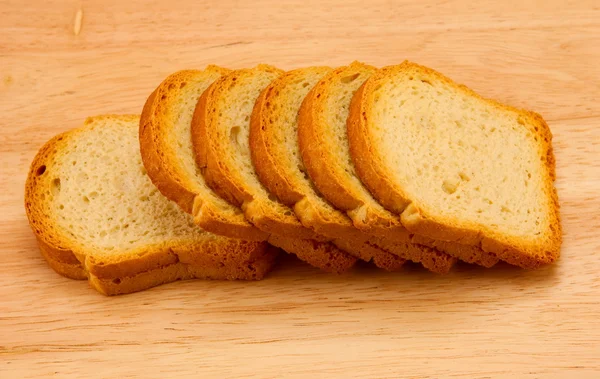 Sneetjes brood op houten — Stockfoto