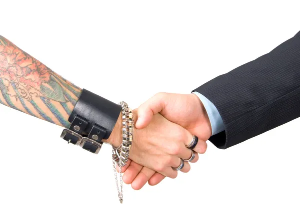 Punk man and businessman hand shake — Stock Photo, Image