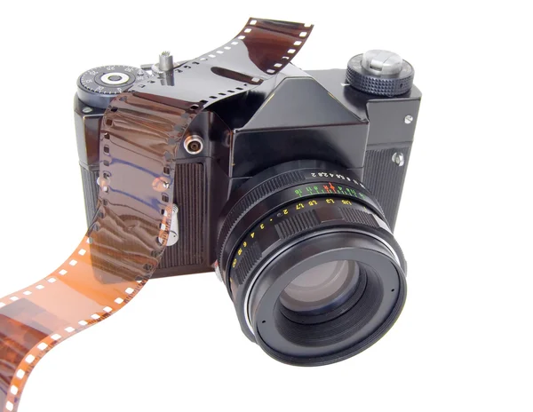 Old camera and film reel — Stock Photo, Image