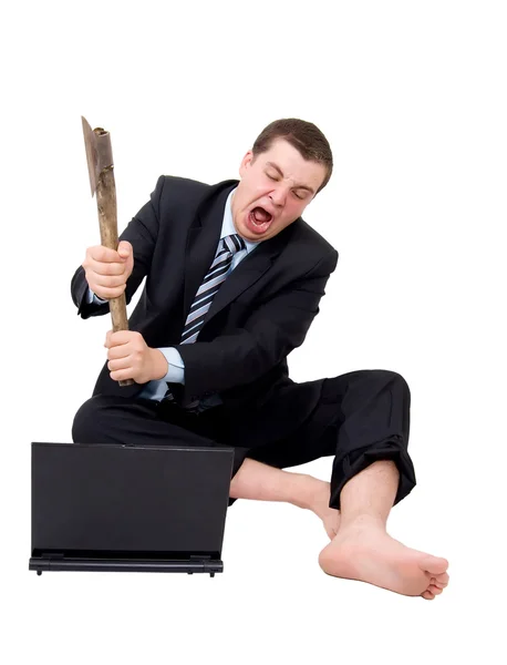 Businessman breaking laptop with axe — Stock Photo, Image