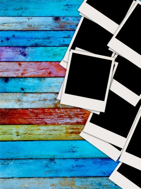 Pile of Blank Photos on Wood Background clipart