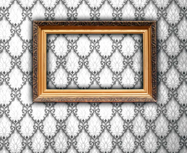 Moldura em branco no papel de parede vintage — Fotografia de Stock