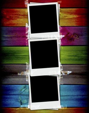 Three Blank Photos on Wood Background clipart