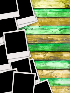 Pile of Blank Photos on Wood Background clipart