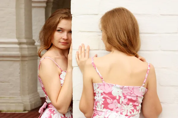 Twins of sister in pink dress Stock Photo