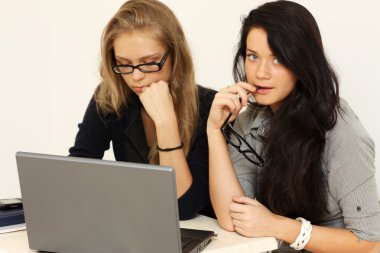 Two young women warking in office clipart