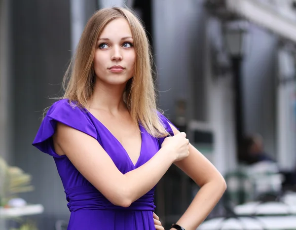 Young woman in blue dress — Stock Photo, Image