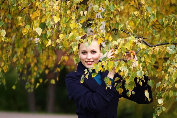 Happy girl at a white birch — Stock Photo, Image