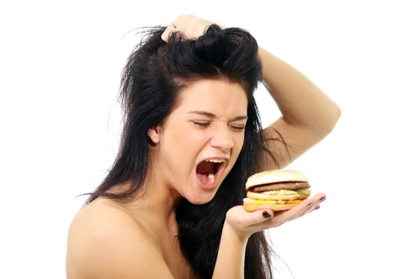 Bir sandviç tutan kadın yan görünüm — Stok fotoğraf