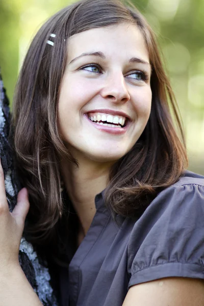 Happy girl at a white birch — Stock Photo, Image